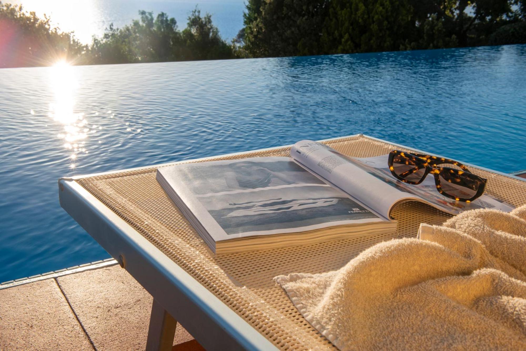 Boutique Hotel Torre Di Cala Piccola Порто Санто Стефано Екстериор снимка